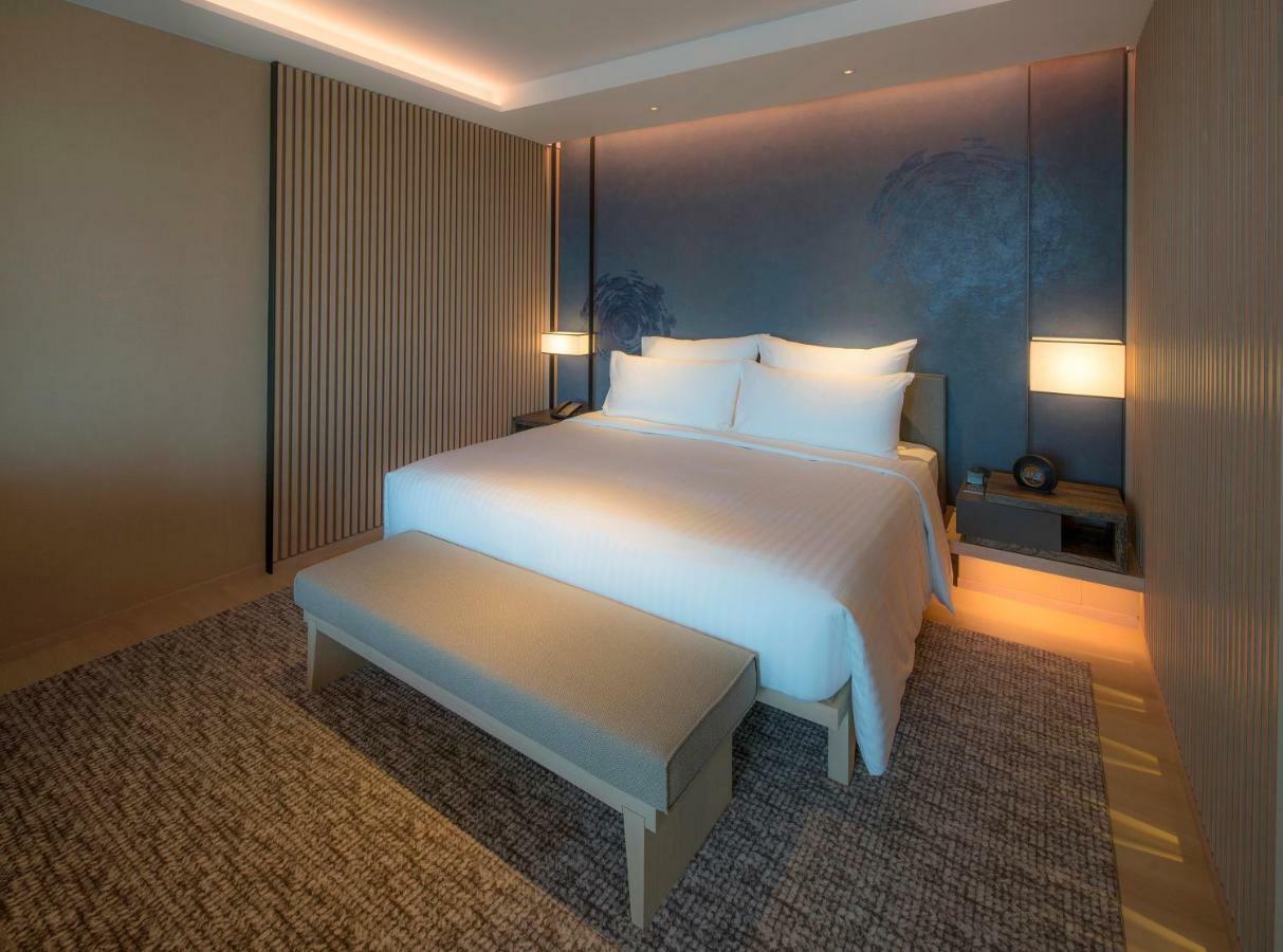 Mu Jiaoxi Hotel Εξωτερικό φωτογραφία A bedroom at the hotel